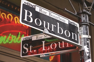 A view of a street sign spelling out Bourbon Street in New Orleans.