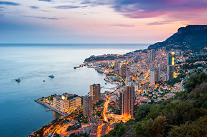 An aerial view of the Monaco coast during sunset.