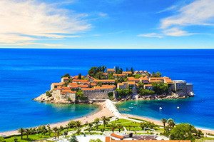 The picturesque walled city of Budva, surrounded by deep blue waters.