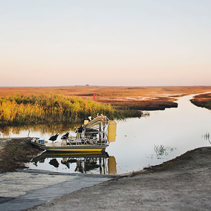 An airboat parked by the Everglades before a tour.