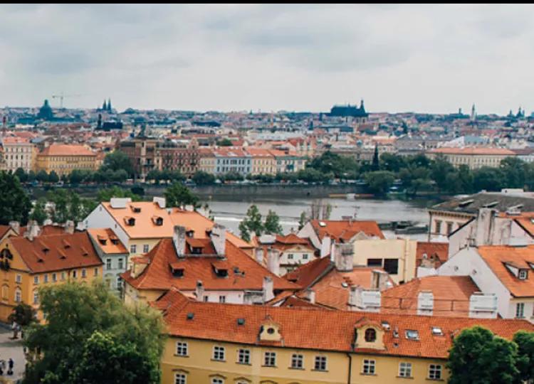 People walking across the Charles Bridge in Prague.