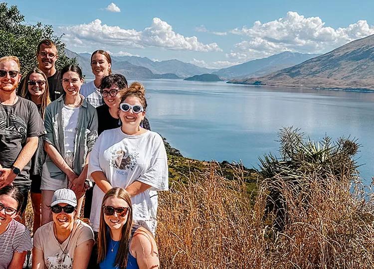 Topdeck tour group posing for a photo during their tour across Mou Waho Island