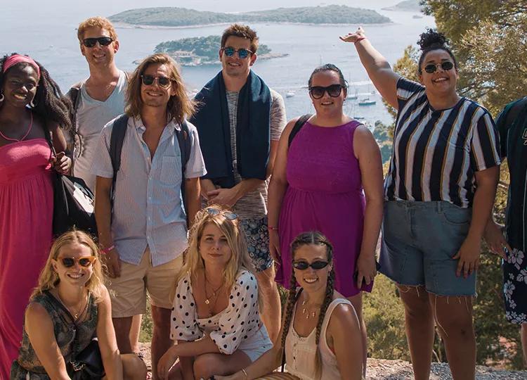 Topdeck travellers taking a group photo during a tour of Croatia.