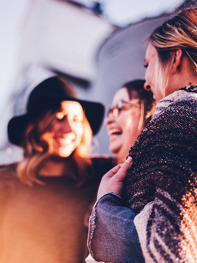 A group of Topdeck travelers laughing together.