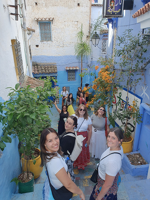 A Topdeck tour group travels through the colourful streets of Chefchaouen in Morocco. Known for it's blue buildings.