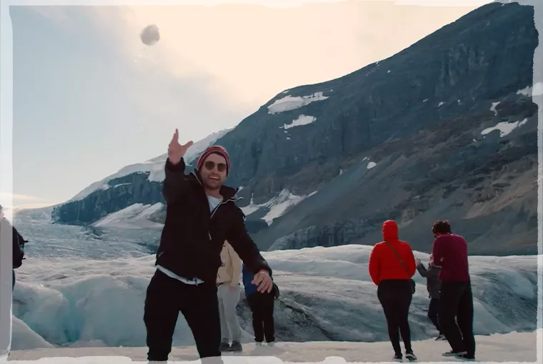 Topdeck travelers having a snowball fight.